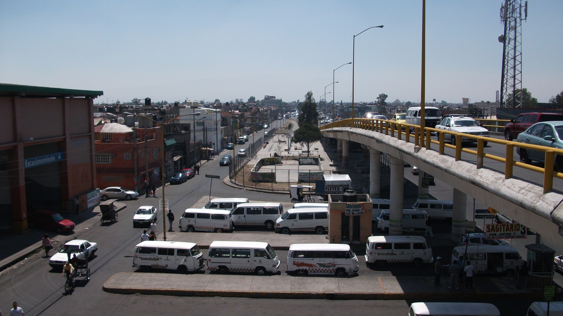 Overpass with vans parked underneath