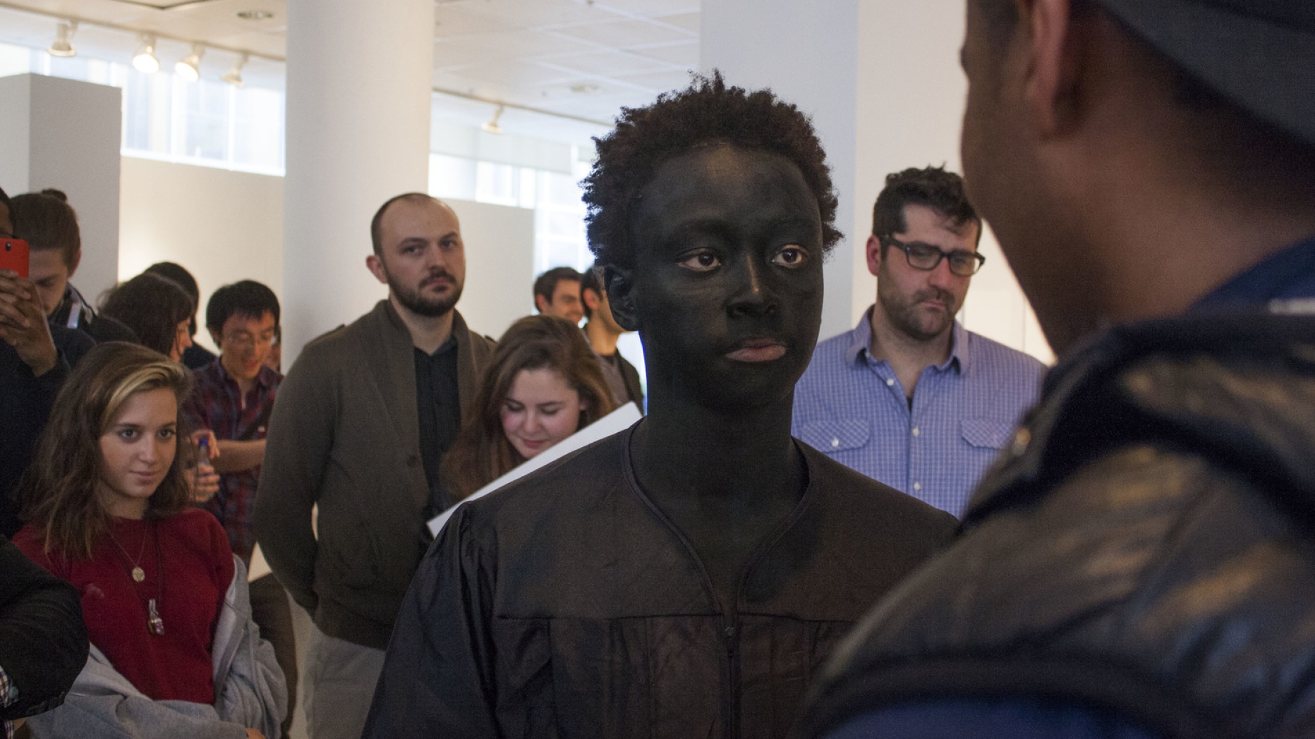 Performance art piece featuring a student in blackface.