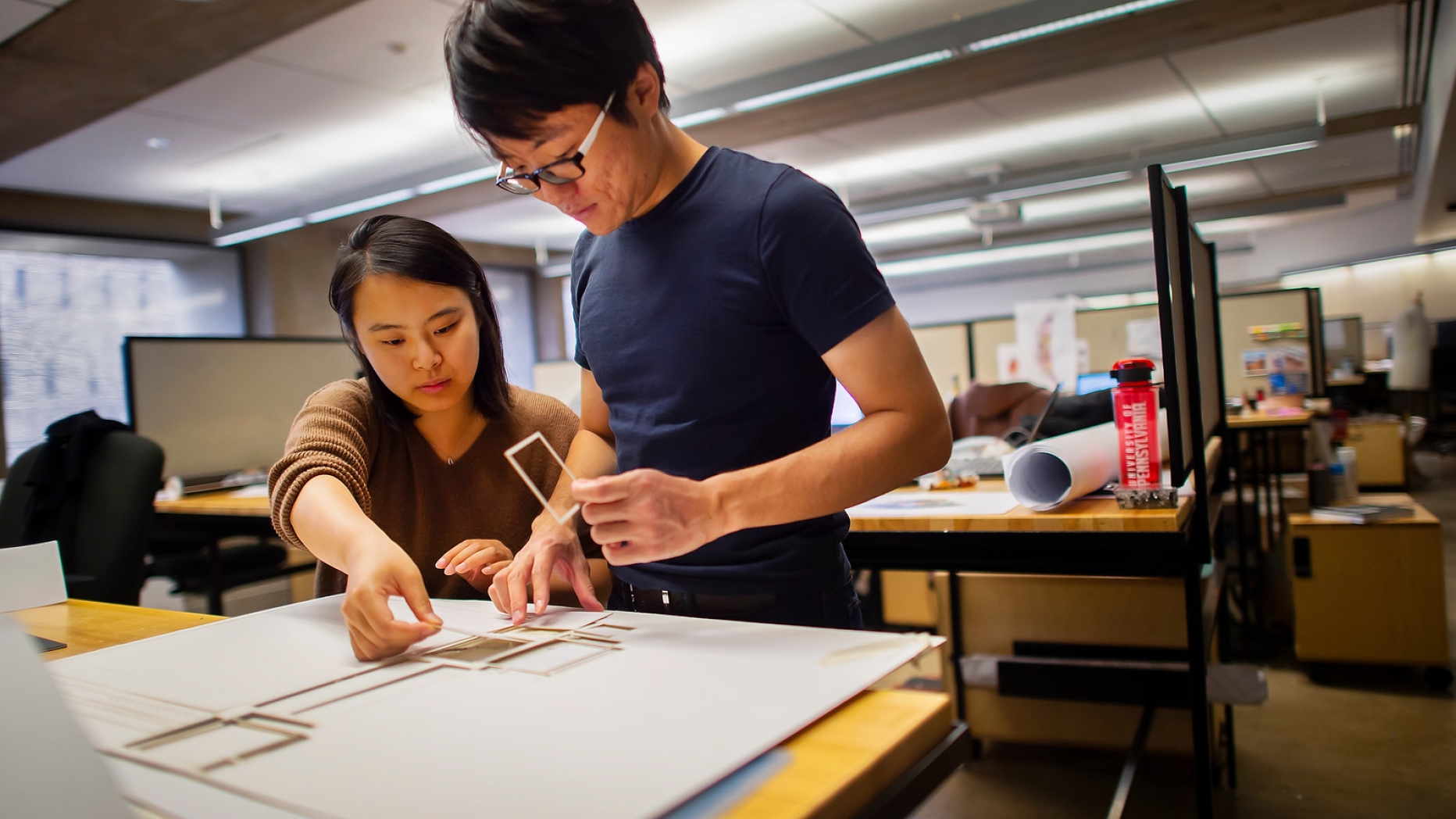 Two students working together in studio.