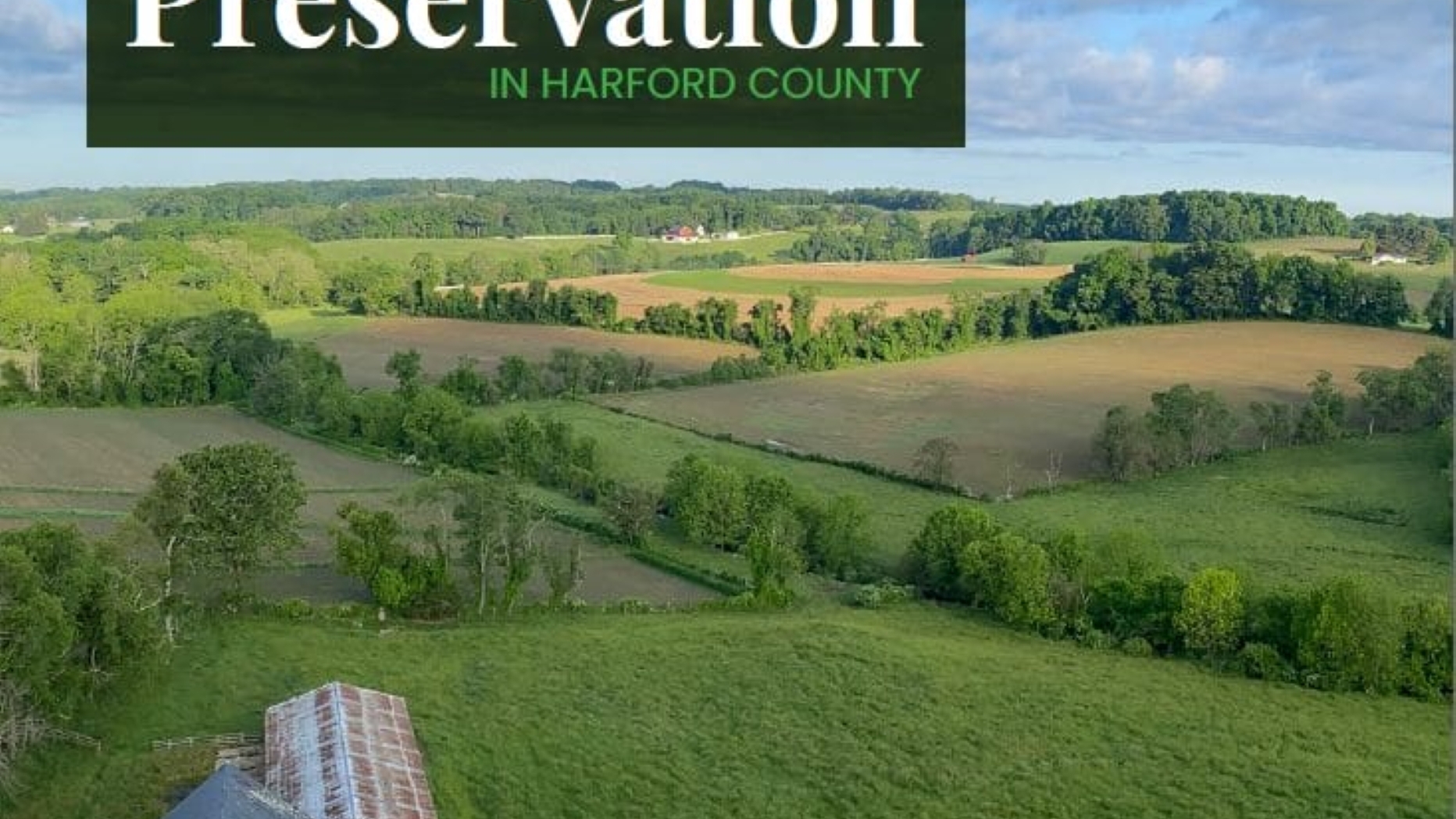 Overhead shot of a house and grassy hills with the text "State of Land Preservation" in the upper left corner.