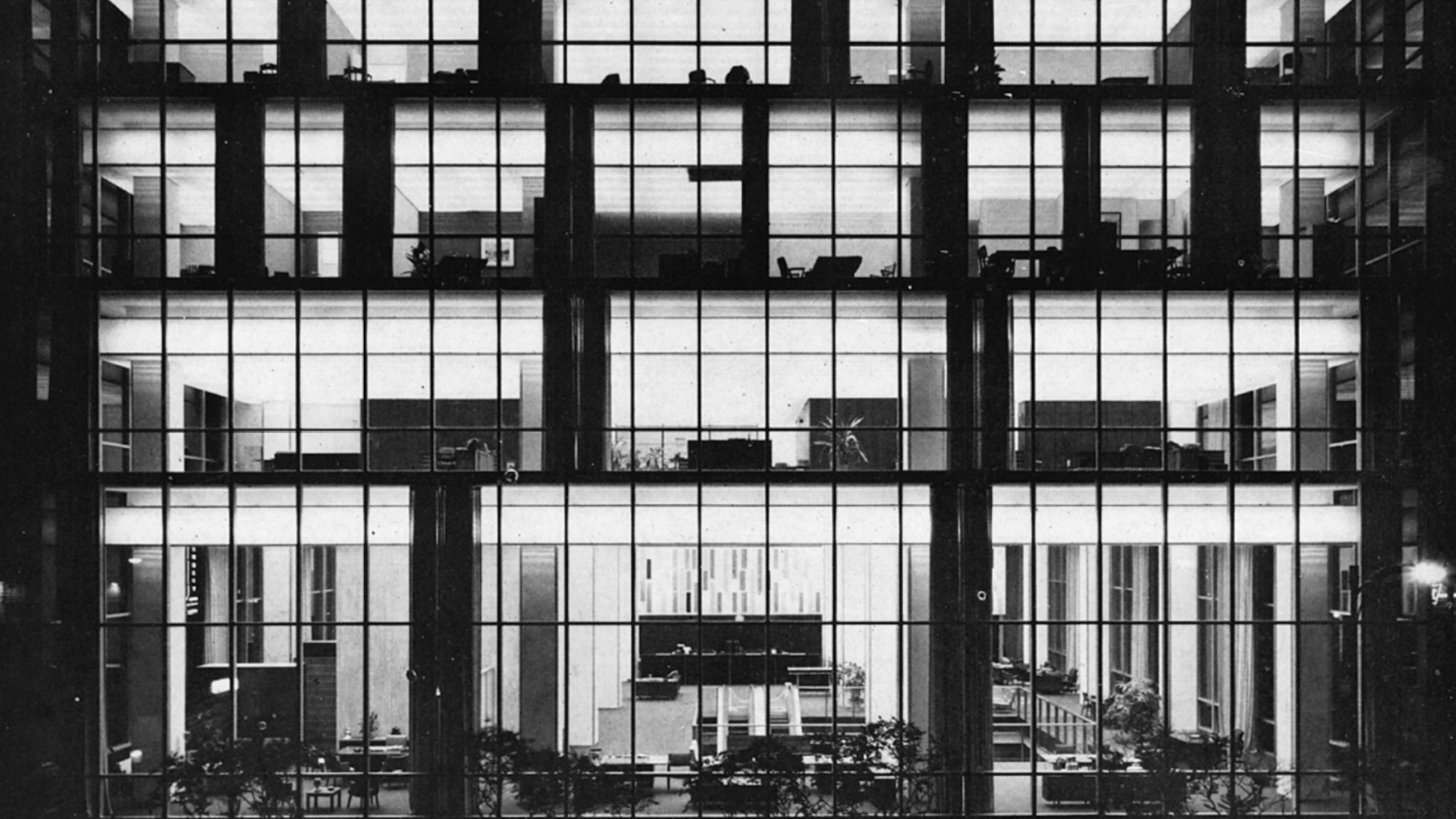 black and white photo of building facade covered in windows