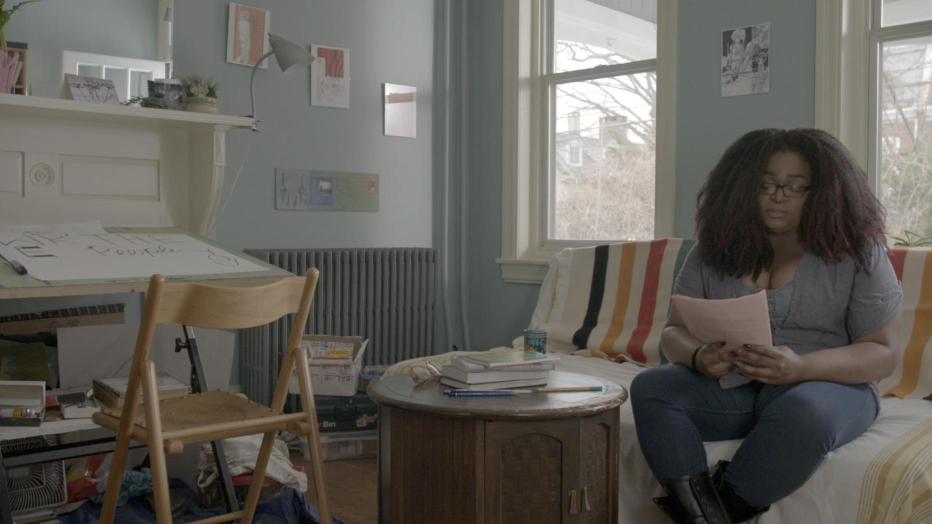 Woman sitting on a couch reading