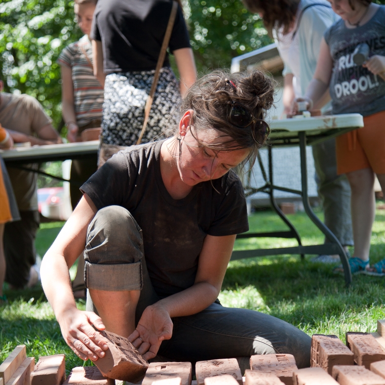 Marian Glebes working with bricks