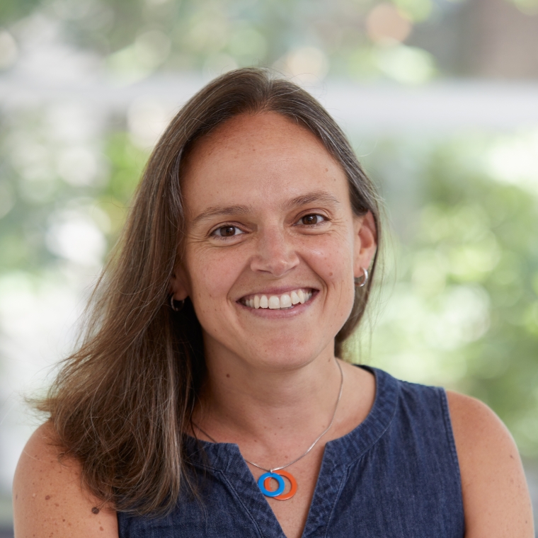 Headshot of Francesca Russello Ammon wearing a blue shirt