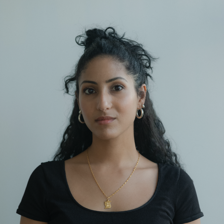 Photo portrait of Farah Al Qasimi in front of gray background