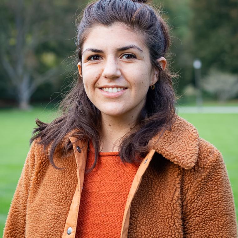 Katie Levesque in orange shirt and jacket