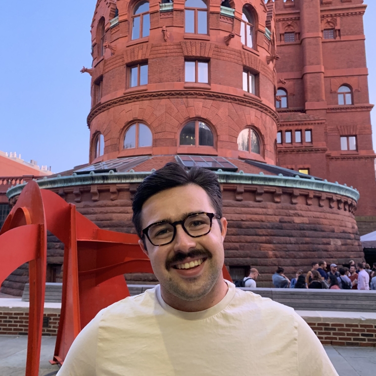 Photo of Dan in front of Fisher Fine Arts Library
