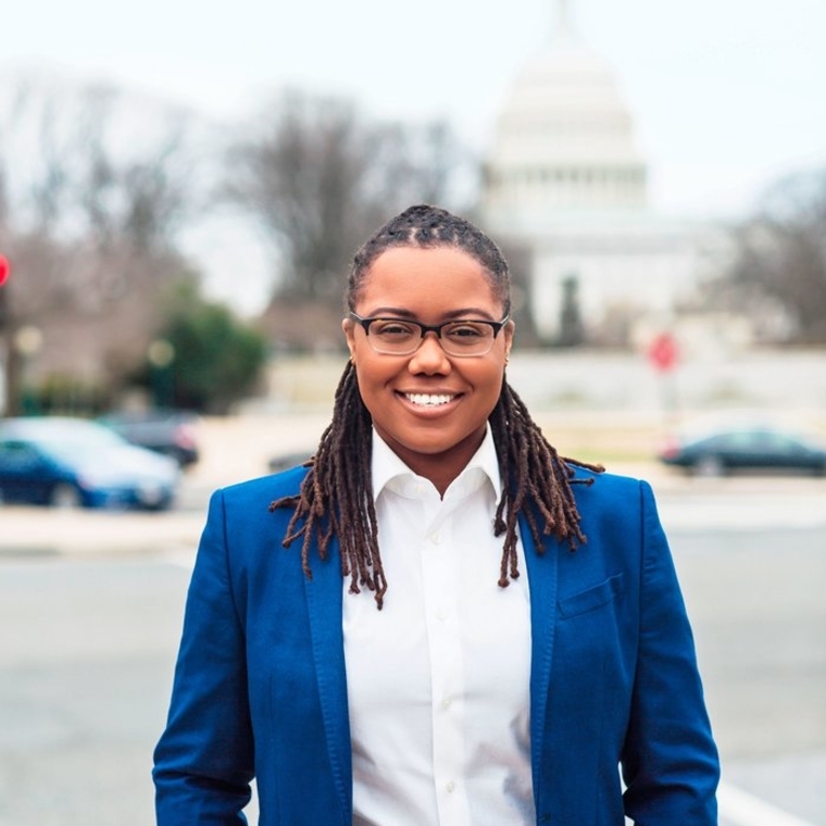 Monica Rhodes in foreground, US Capitol building in background