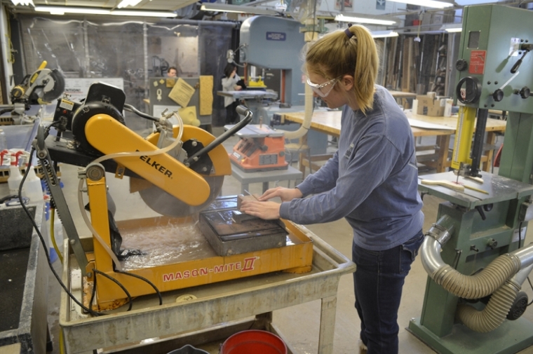 Student working equipment in the lab