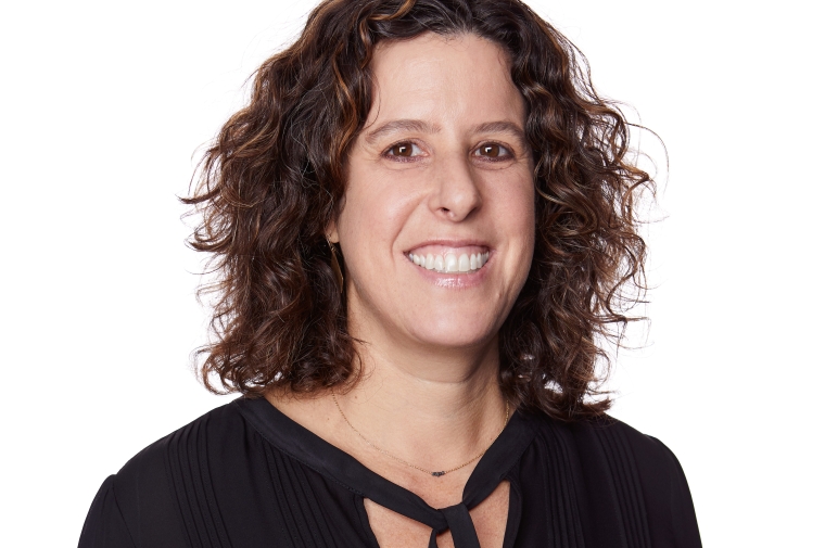 Rottenberg is pictured against a white background, wearing a black top