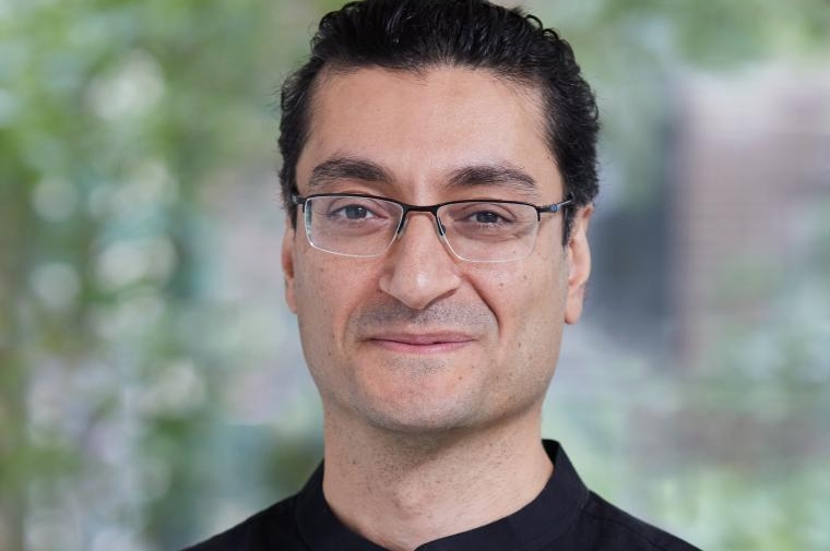 Akbarzadeh wearing a black shirt