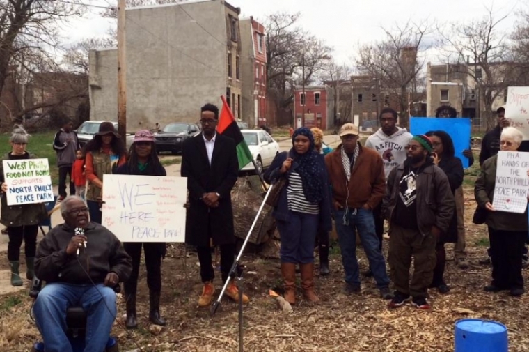 Protesters contest Philadelphia Housing Authority's use of eminent domain to move Peace Park. Photo Credit: AL DIA News