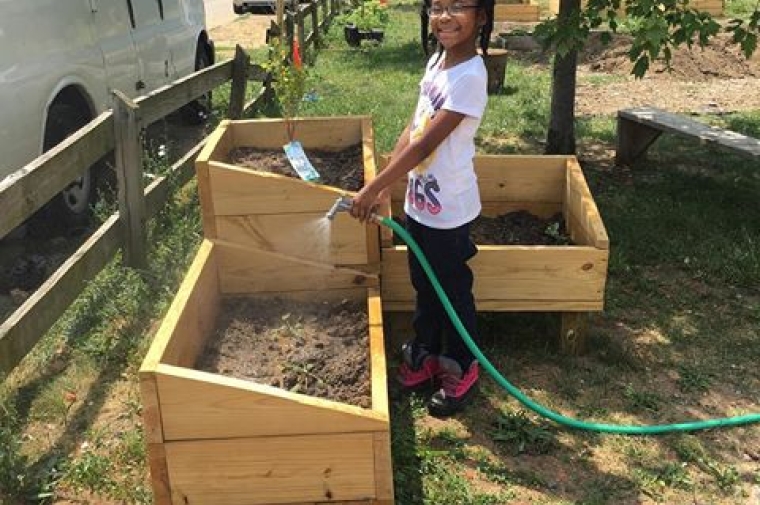 Community members construct garden beds in Phase 01. PhotoCredit: North Philly Peace Park