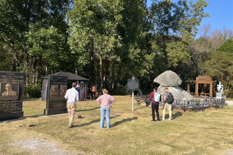 students standing in a memorial