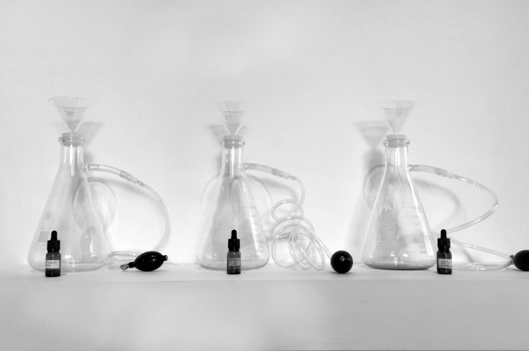 Three laboratory beakers with tubes coming out of them