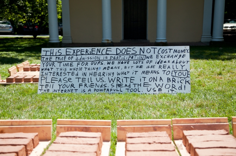 hand-written sign on grass