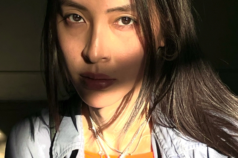 Photograph portrait of Diane Severin Nguyen partially in shadow