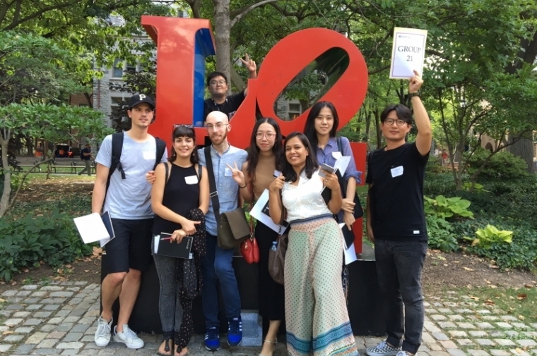 Diverse group of students in front of LOVE statue