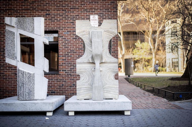 Geometric concrete totems on concrete plinths