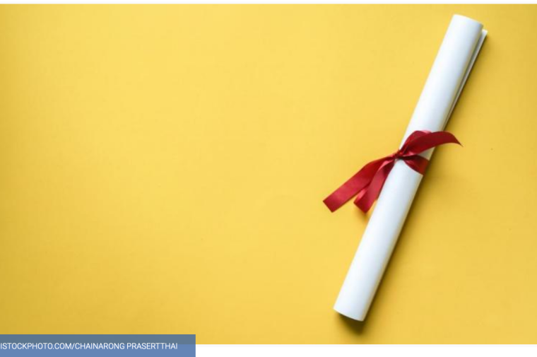 Diploma wrapped in red ribbon