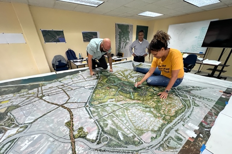 Group of people on landscape drawing on a table