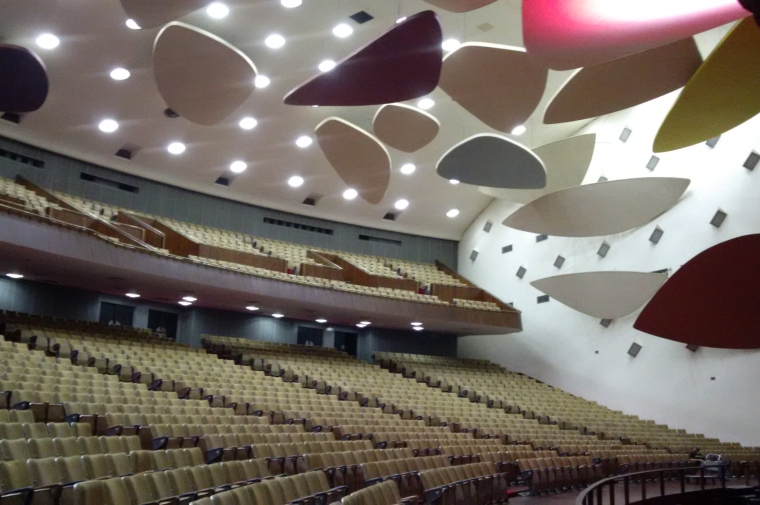 photo of auditorium with sculptural shapes hanging from ceiling