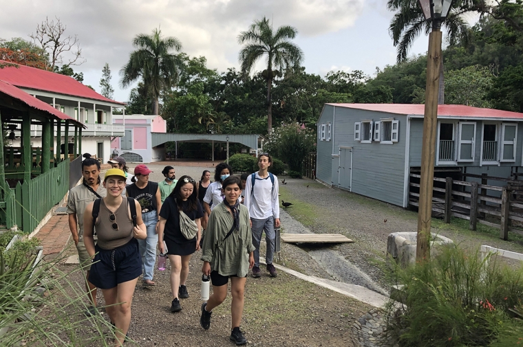 A group of students walking through a neighborhood in Puerto Rico