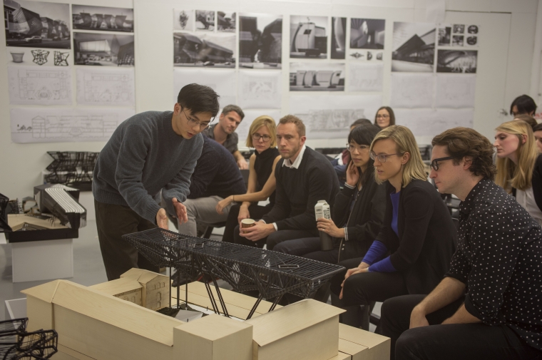 Student presents a model to a row of seated jurors