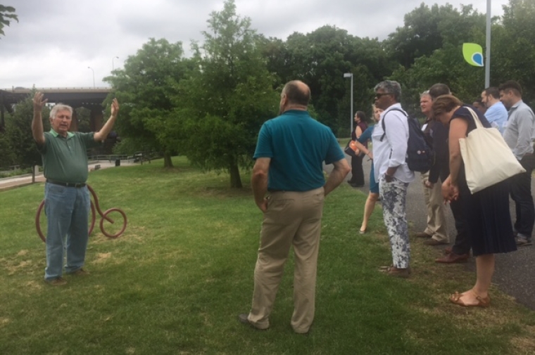 Joe Syrnick, CEO of Schuylkill River Development Corporation (SRDC) welcomes participants to Grays Ferry Crescent and describes its future connections, and neighborhood use.