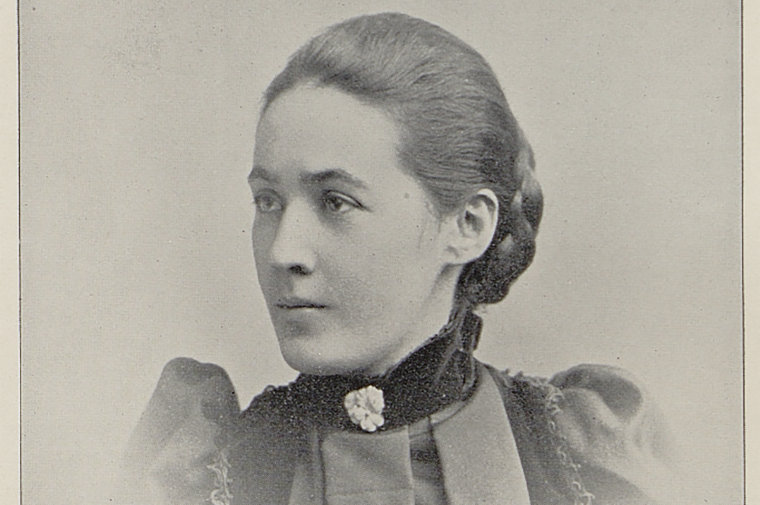 Sepia toned photograph of a young 19th century woman in a dress