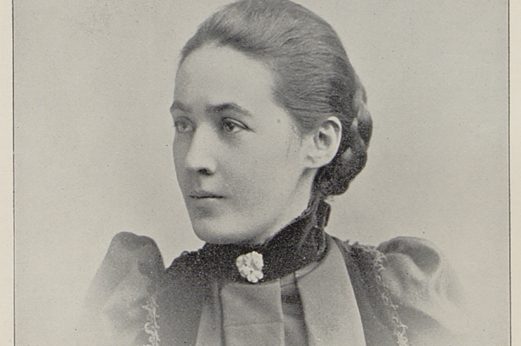 Sepia toned photograph of a young 19th century woman in a dress