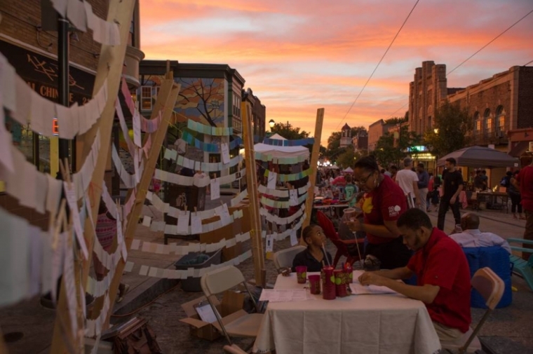Notecards and neighborhood memorabilia are hung to convey neighborhood character