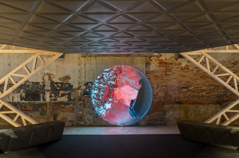 Luminous sphere framed by wood trusses
