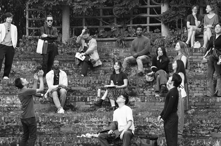 Group of young people seated in terraced landscape