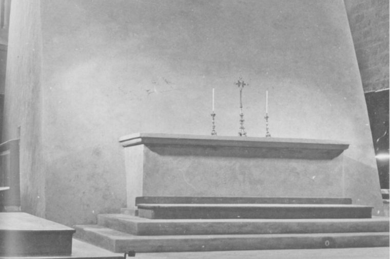 Black and white photo of an altar with candles