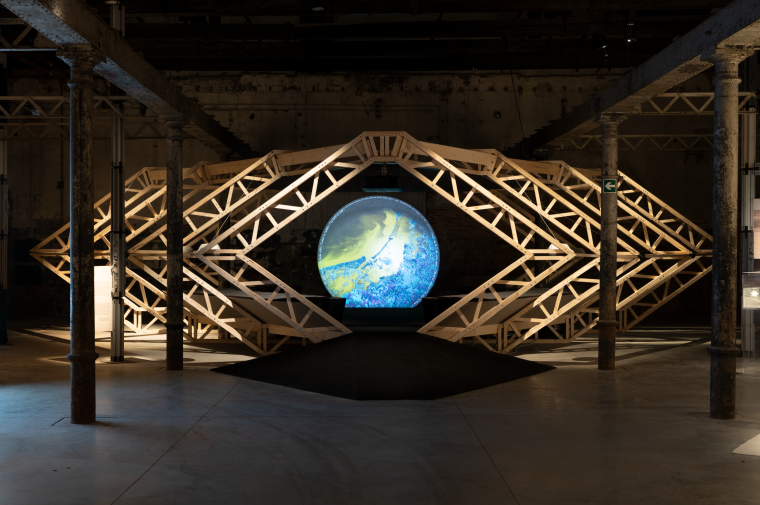 Blue marble projected inside wooden trusses