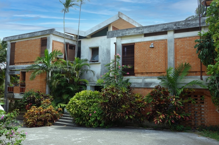 modernist house with lush foliage