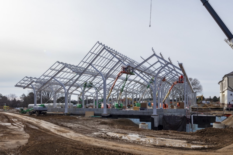 View of construction in progress of conservatory showing white framework