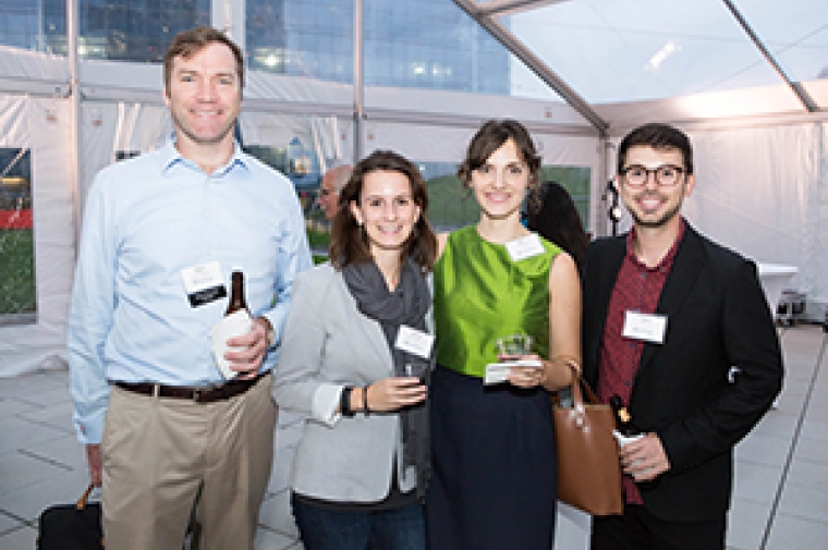 Group of people under tent at reception