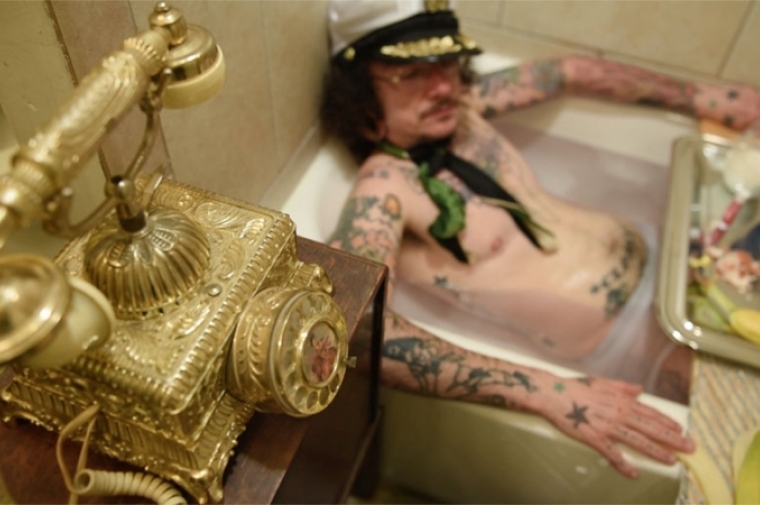 Photograph of man in bath