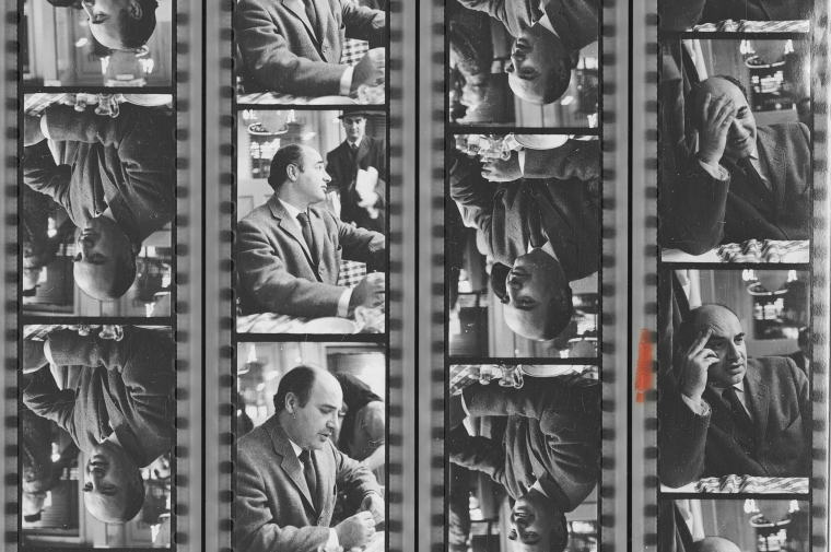 four strips of film showing shots of Giurgola