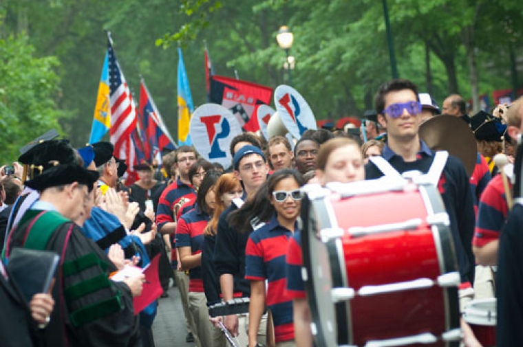 People in parade wearing school colors