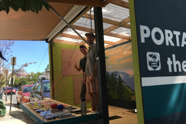 Service team members inside Portal to the Parks stall