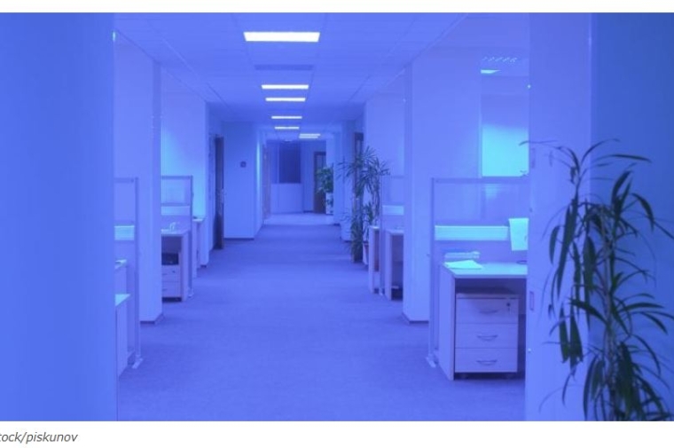 An office space with purple UV light