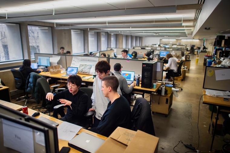 Students working on their computer in studio.