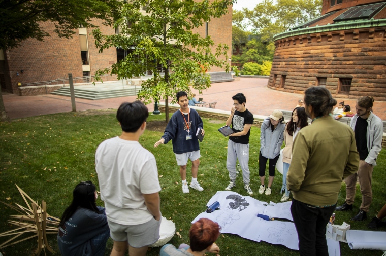 students working outside of Meyerson Hall