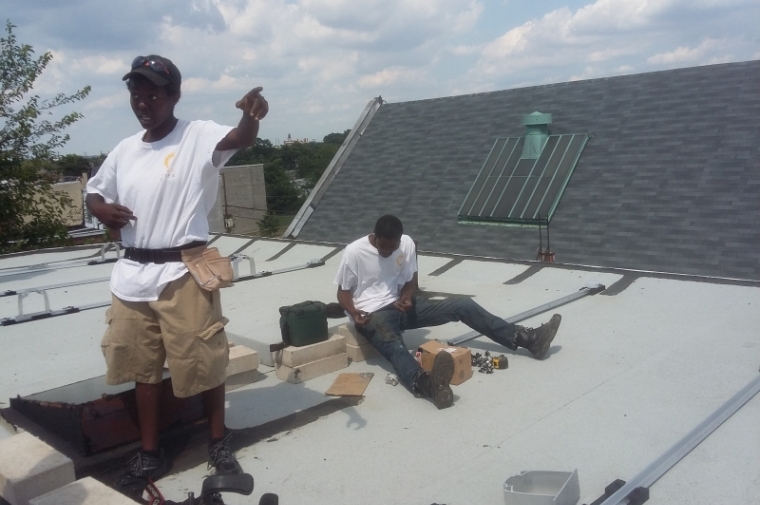 Apprentices Ky and Robert learning about solar installation.