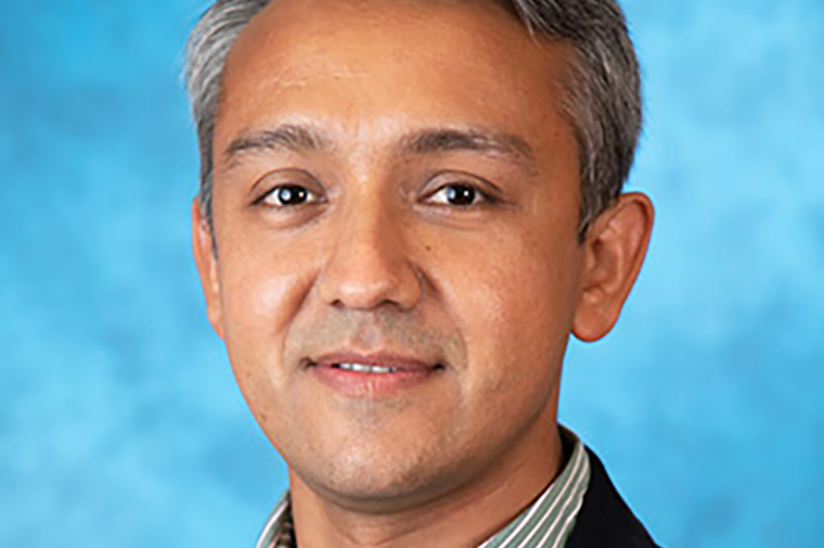 Esteban López Ochoa, headshot over blue background