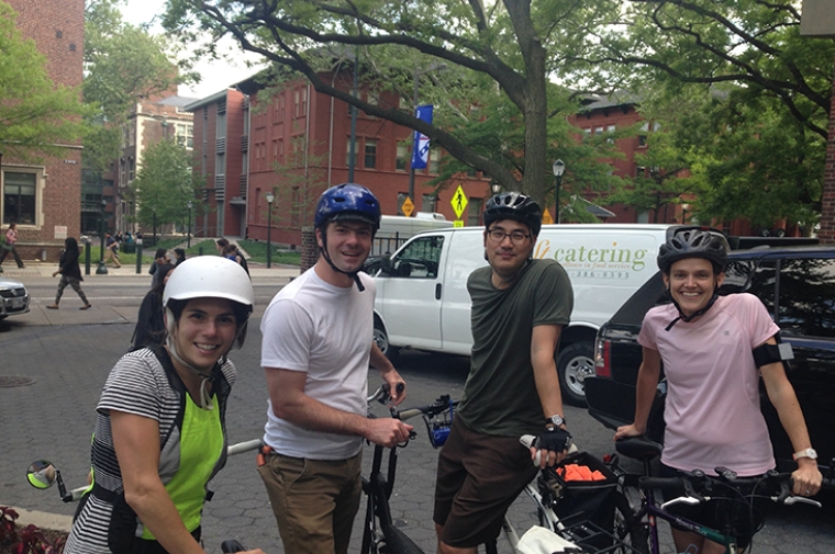 Group photo of several Penn professors with bikes