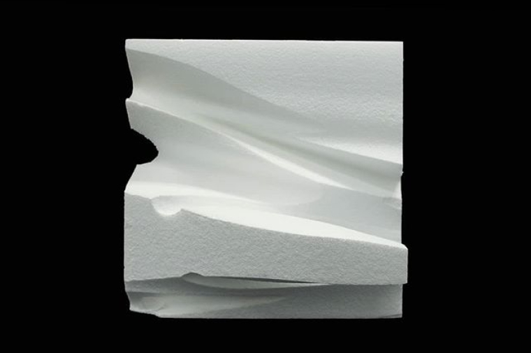 Abstract white block sculpture.